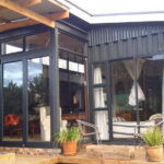 triton off grid container home back zoomed