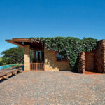 gondwana organic farm container house side brick stone wall