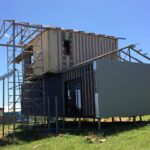 bushland beach container home construction scaffolding