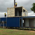 bushland beach container home construction stacking