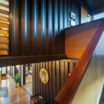 graceville container home stairs reading room