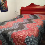 south bloomingville container cabin bedroom quilt