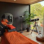 poznan riverfront cabins window telescope