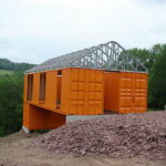 Livingston Manor Container Home exterior orange painted walls