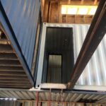 foster container home construction catwalk