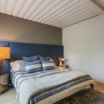 union pier container home one bedroom accent wall